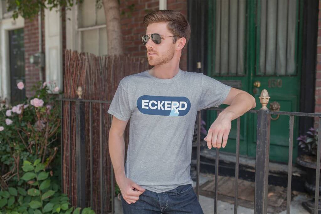 Model wearing a gray Humbrah Eckerd graphic tee